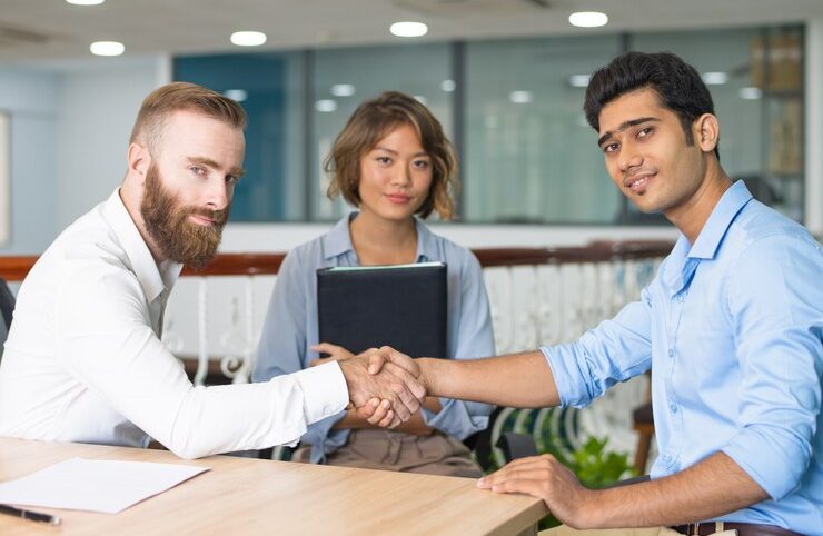 content-indian-candidate-shaking-hands-with-company-leader_1262-17339